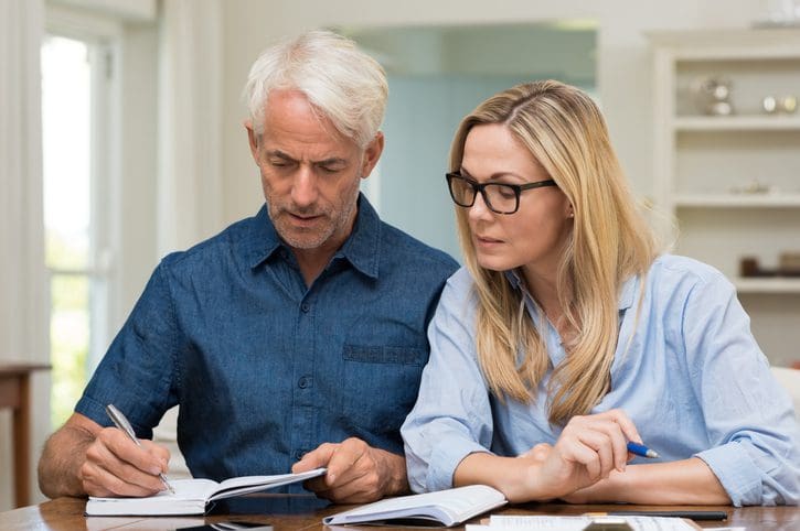 Gill Insurance | Couple calculating bills